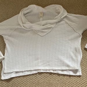 This is a sweater from Free People. It is white and a XS.